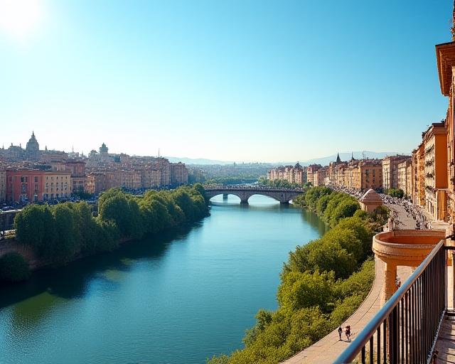 Vista desde la terraza en un día soleado, con el río y la ciudad de fondo